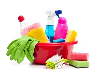 full box of cleaning supplies and gloves isolated on white